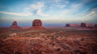 Desert rocks dirtroad clouds blue - a desert landscape free wallpaper for desktop