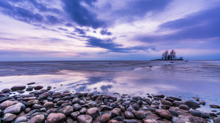 Rocky beach island cloudy sky - a small island in the distance free wallpaper