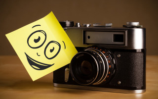 Camera smiley yellow sticker art - a smiley face free wallpaper