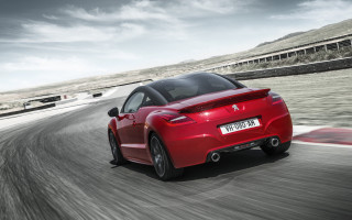 Red sports car cloudy sky 17 - a car free wallpaper