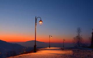 Snowy road mountain sunset lamp - a street light free wallpaper