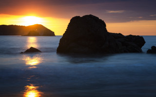 Sunset water rocks island bridge 2 - a small island in the distance free wallpaper