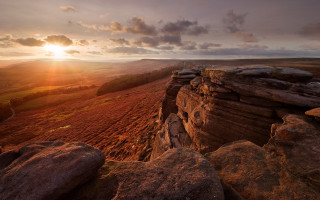 Sunset cliff field clouds rocks - a few rock below free wallpaper