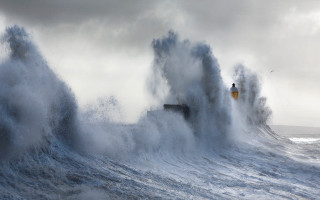 Lighthouse waves ocean shore cloudy - a large wave free wallpaper for desktop