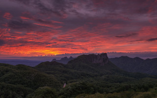 Sunset mountain range red sky 3 - a few tree below free wallpaper