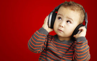 Young boy headphones listening music - a young boy free wallpaper