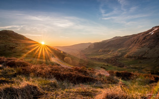 Sunset mountain valley road range - a mountain range in the background free wallpaper
