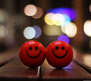Red balls painted faces table - a table in front free wallpaper for tablet