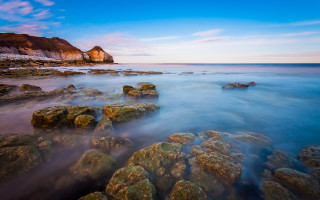 Rocky beach cliff blue sky - a rocky beach free wallpaper
