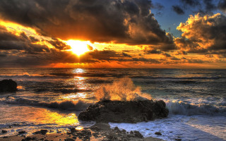 Sunset ocean waves rocks clouds 3 - a sunset over the ocean free wallpaper