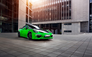 Green sports car city street 3 - the building free wallpaper