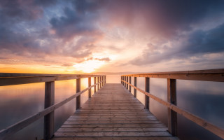 Wooden dock sunset cloudy sky - a wooden dock free wallpaper