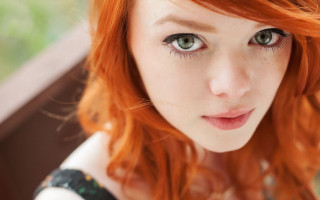 Red hair green eyes black - a close up of a person free wallpaper