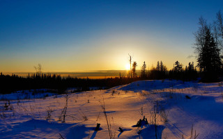 Sunset snowy field trees city - a few snow free wallpaper