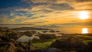 Sunset water rocks grass houses - a few house free wallpaper