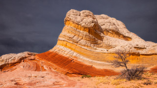 Rock formation tree sunset clouds - a dark sky in the background free wallpaper