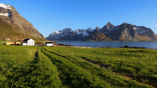 Grassy field house mountains water - the background and a body of water free wallpaper