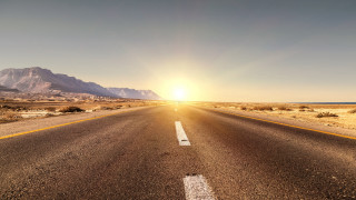Sunset mountains road lens flare - a bright sun free wallpaper