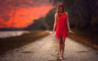 Woman red dress sunset outstretched - a dirt road free wallpaper for desktop