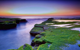 Sunset rocky beach moss water 5 - a long exposure of a sunset over a rocky beach free wallpaper