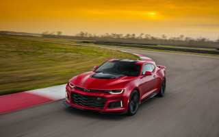 Red chevrolet camaro sunset race - a race track free wallpaper