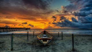 Boat beach sunset pier clouds - a pier in the background free wallpaper