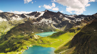 Mountain lake snowy horizon nature 2 - a mountain range in the background free wallpaper