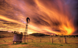 Windmill field sunset clouds fence - a windmill in a field free wallpaper