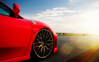 Red sports car sunshine blue - the sun shining behind free wallpaper