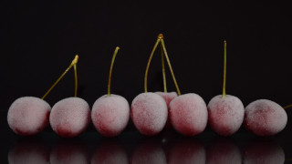 Pink fruit row black surface - food photography free wallpaper for desktop