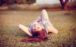 Woman grass blowing hair portrait - her eye free wallpaper for desktop