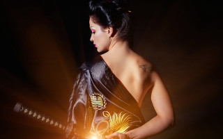 Woman black dress lit sword - a black background behind her free wallpaper for desktop