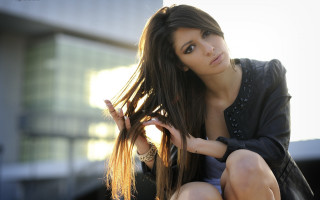 Woman blowing hair ledge building - a ledge free wallpaper for desktop