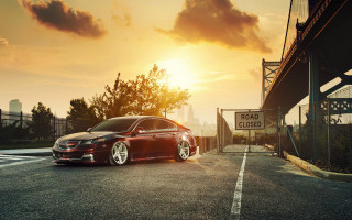 Red car bridge sunset clouds - a red car free wallpaper