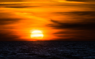 Sunset ocean boat plane beach - derold page free wallpaper