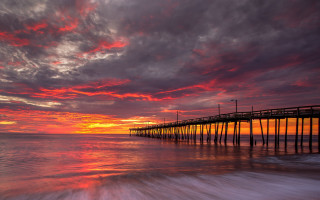 Pier sunset red sky water - colorful cloud free wallpaper