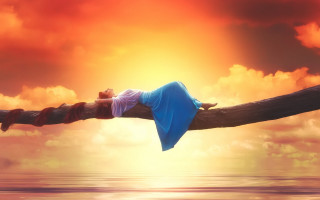 Woman lying wooden pole over - dreamlike free wallpaper for desktop
