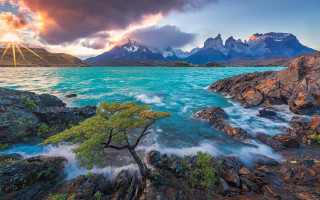 Tree water rocks mountains sunset 2 - a cloudy sky free wallpaper for desktop