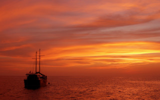 Boat sunset orange red clouds - a boat free wallpaper for desktop