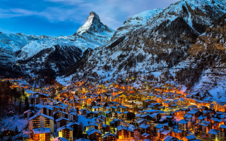 Snowy mountain town night lights - city background free wallpaper for desktop