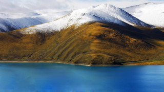 Mountain range lake snow clouds - a lake in the foreground free wallpaper