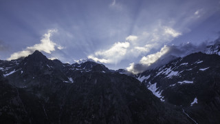 Mountain range clouds snowy background - free winter wallpaper