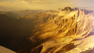 Mountain range plane window clouds - a plane window free wallpaper