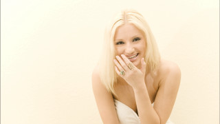 Blonde woman ring portrait whitewall - a white wall behind her free wallpaper