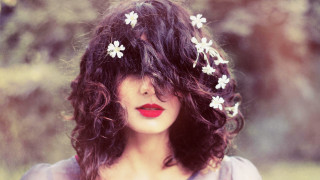 Woman flower hair fashion portrait - her hair and a flower free wallpaper