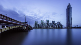 City skyline bridge water tall - a tall building in the background free wallpaper