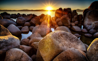 Sunset water rocks lens flare - rock and boulders free wallpaper