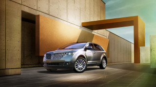 Silver car building open door - a silver car free wallpaper