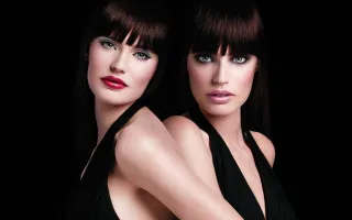Two women dark hair blue - promotional free wallpaper