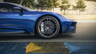 Blue sports car yellow stripe 3 - the side of the road in front free wallpaper